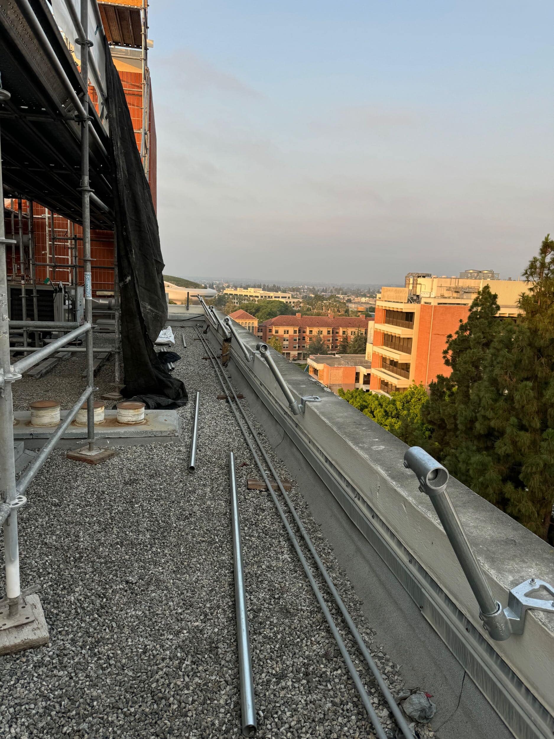 Beginning stages of installing a permanent roof guardrail