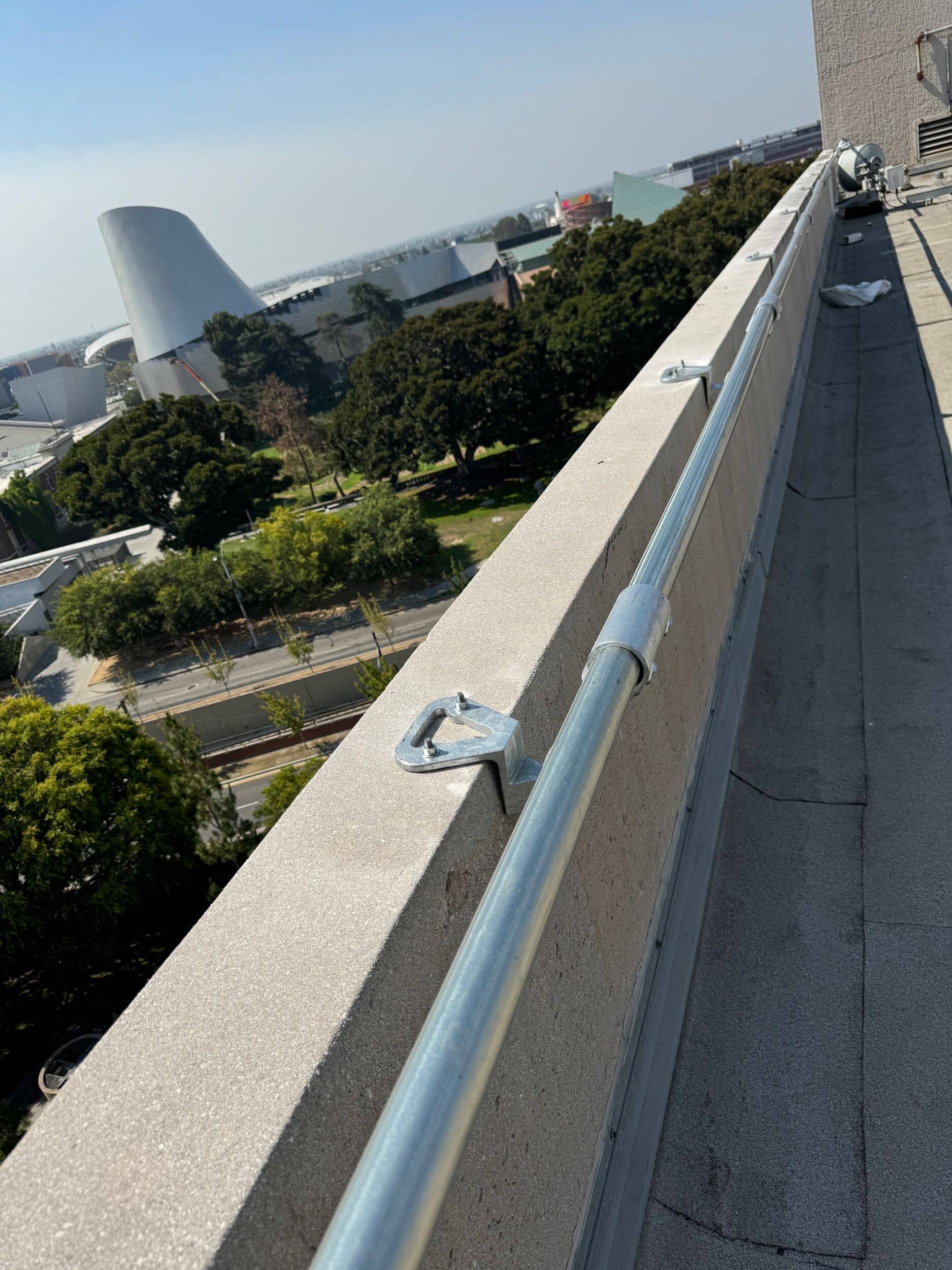 Permanent guardrail system installed on a rooftop