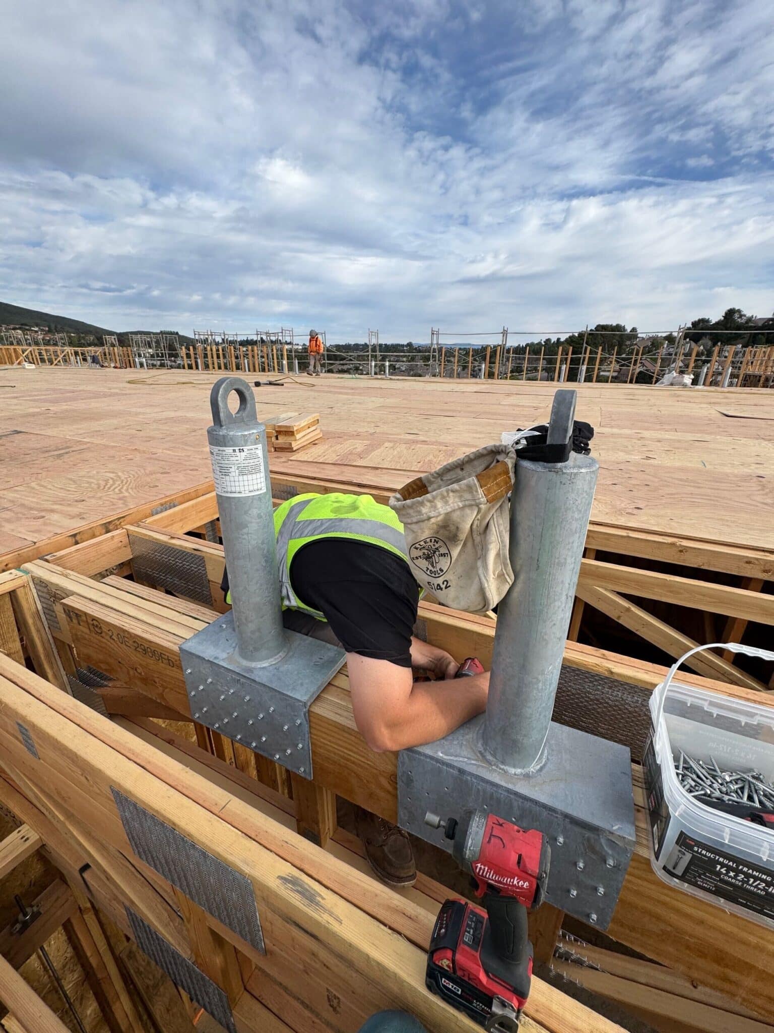 Facade access system anchor installation on commercial building structure in California